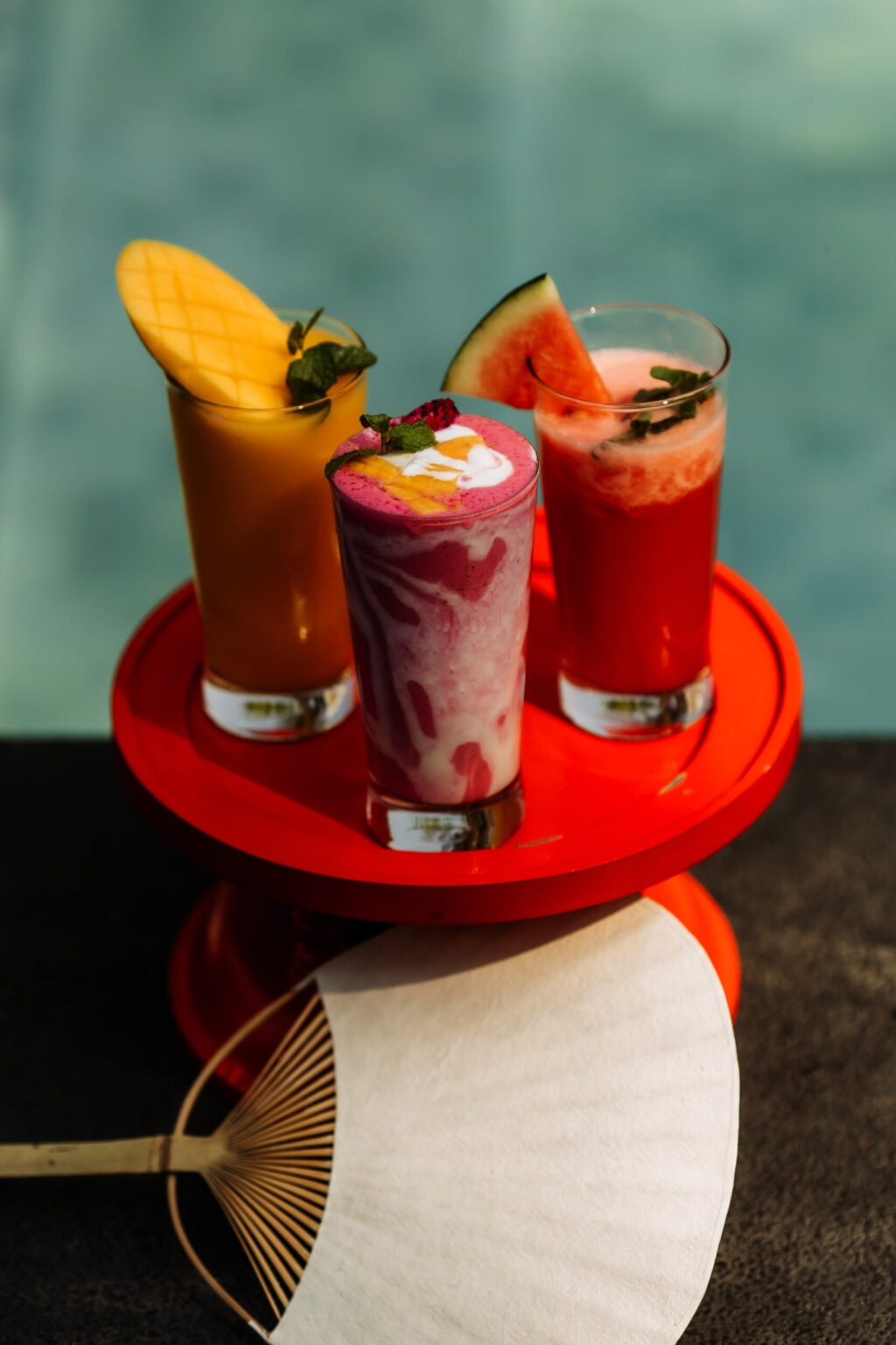 Refreshing drinks by the pool at Souphattra Hotel Luang Prabang